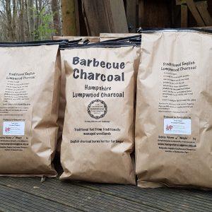 three hampshire coppice craftsmens group branded charcoal bags loaded and ready to go