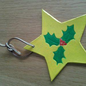 hand carved christmas star or festive star with ivy leaves