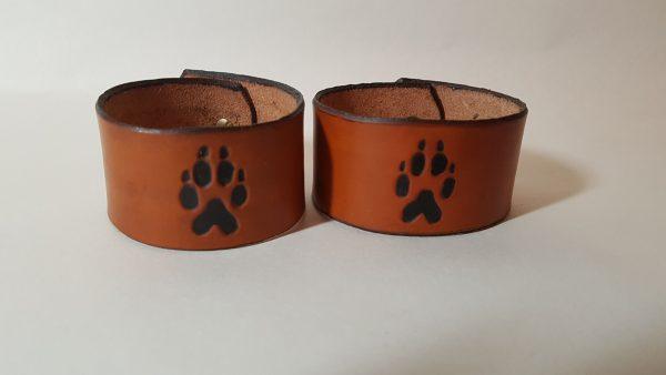 our wolf paw cuff with the paw motif picked out in black with a light tan finnish