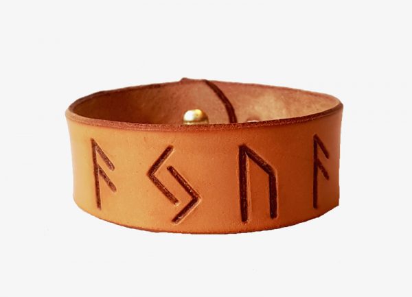 A narrow cuff with AJUA stamped into it in runes made from leather