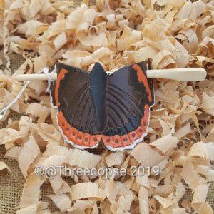 our Red Admiral hair barrette on shavings