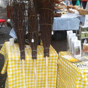 three besom brooms ready to fly