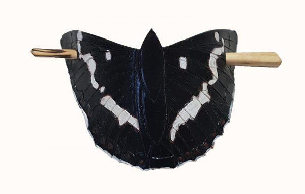 a hand tooled and painted leather hair barrette depicting a white admiral butterfly