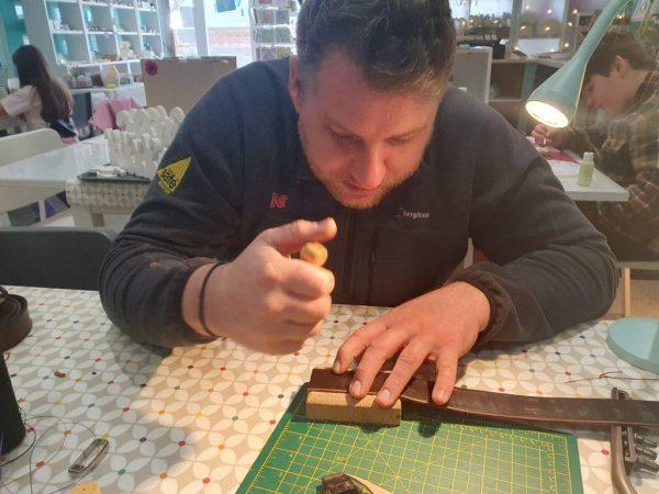 Make a belt course - a man making a leather belt